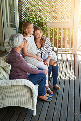 Buy stock photo Full length shot of a young girl sitting outside with her mother and grandmother