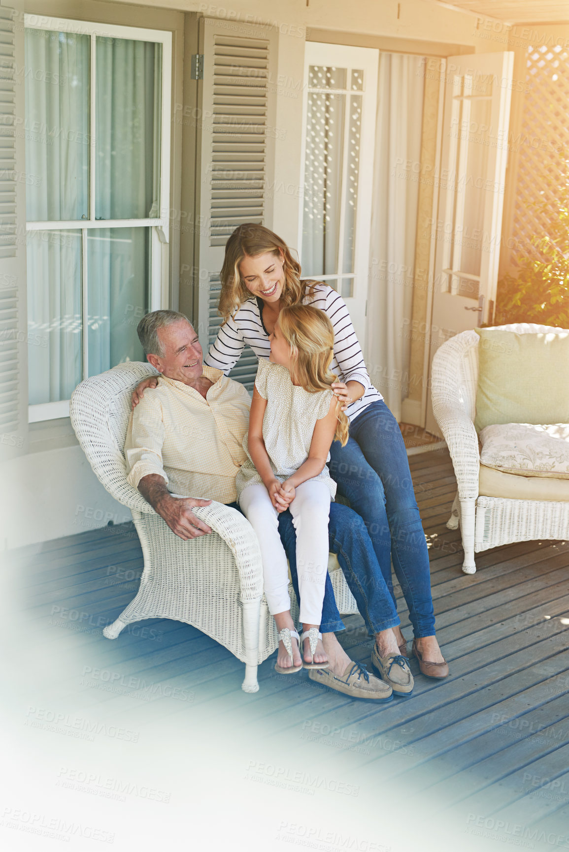 Buy stock photo Full length shot of a young girl sitting outside with her mother and grandfather