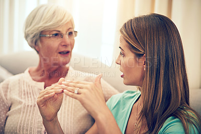 Buy stock photo Cropped shot of a woman chatting with her elderly mother at home