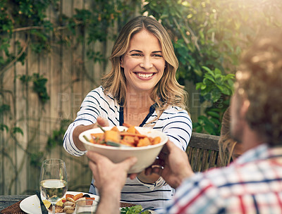 Buy stock photo Shot of a happy couple enjoying an outdoor lunch