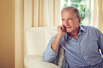 Buy stock photo Cropped shot of an elderly man sitting in a chair at home
