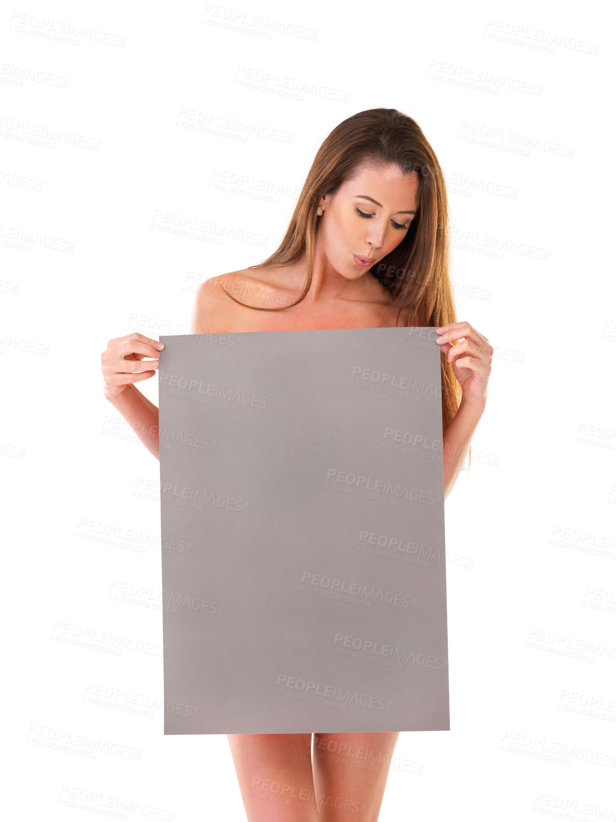 Buy stock photo Studio shot of a nude young woman covering herself with a blank field of tan copyspace