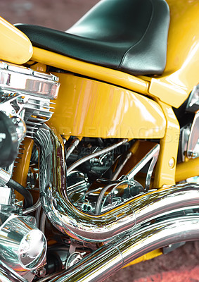 Buy stock photo Closeup of a custom design motorbike with chrome leather seat. Details of a yellow luxury motorcycle. An upgrade to a motorcycle with expensive motor components at an auto parts and service store