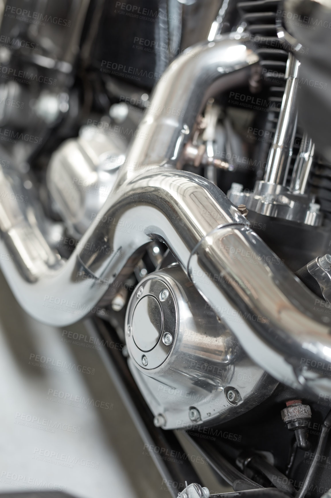 Buy stock photo Chrome plated bend exhaust outlet pipe of a modern motorbike. An engine block with the exhaust pipe of the latest motorcycle. Motorcycle engine clutch casing with shiny chrome parts closeup detail