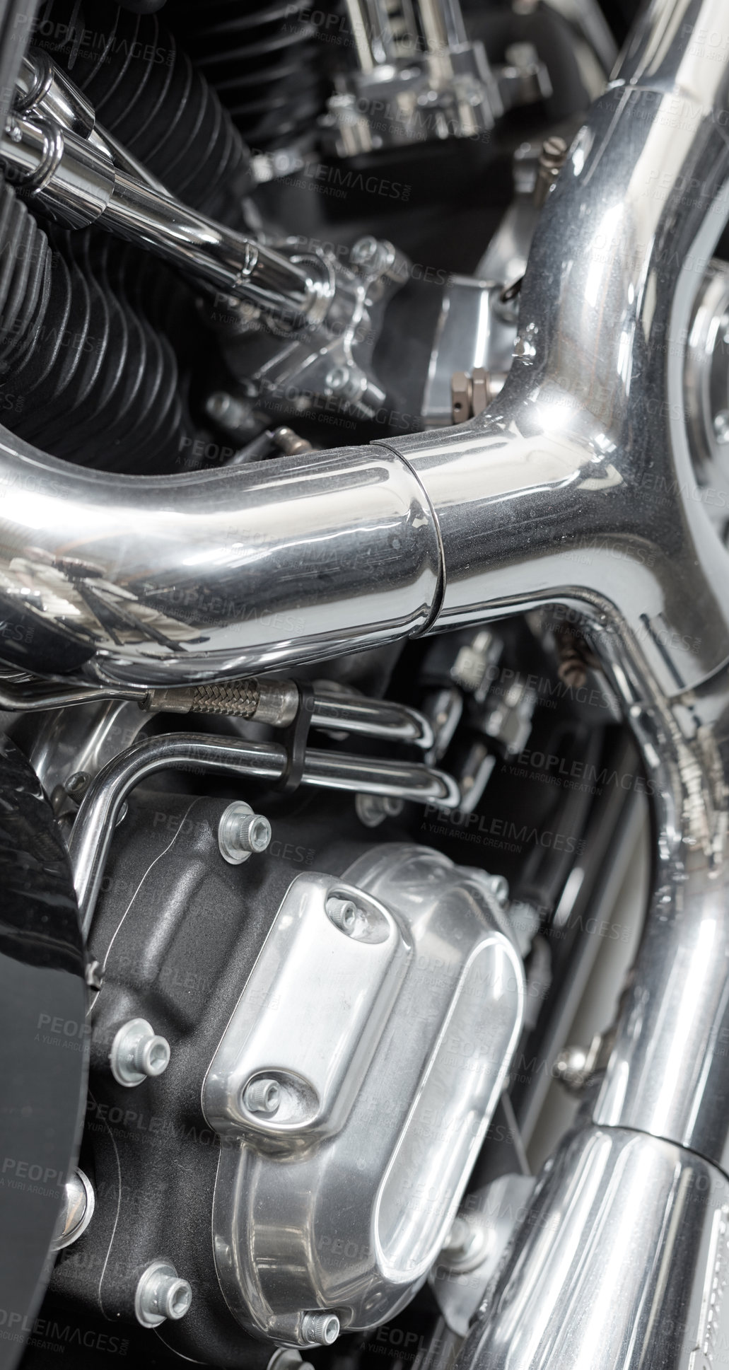 Buy stock photo Closeup of an old classic retro style motorbike with full shiny chrome finish. Detail view of the engine and frame on an vintage motor cycle with black cylinders, shiny chrome pipes and bolts