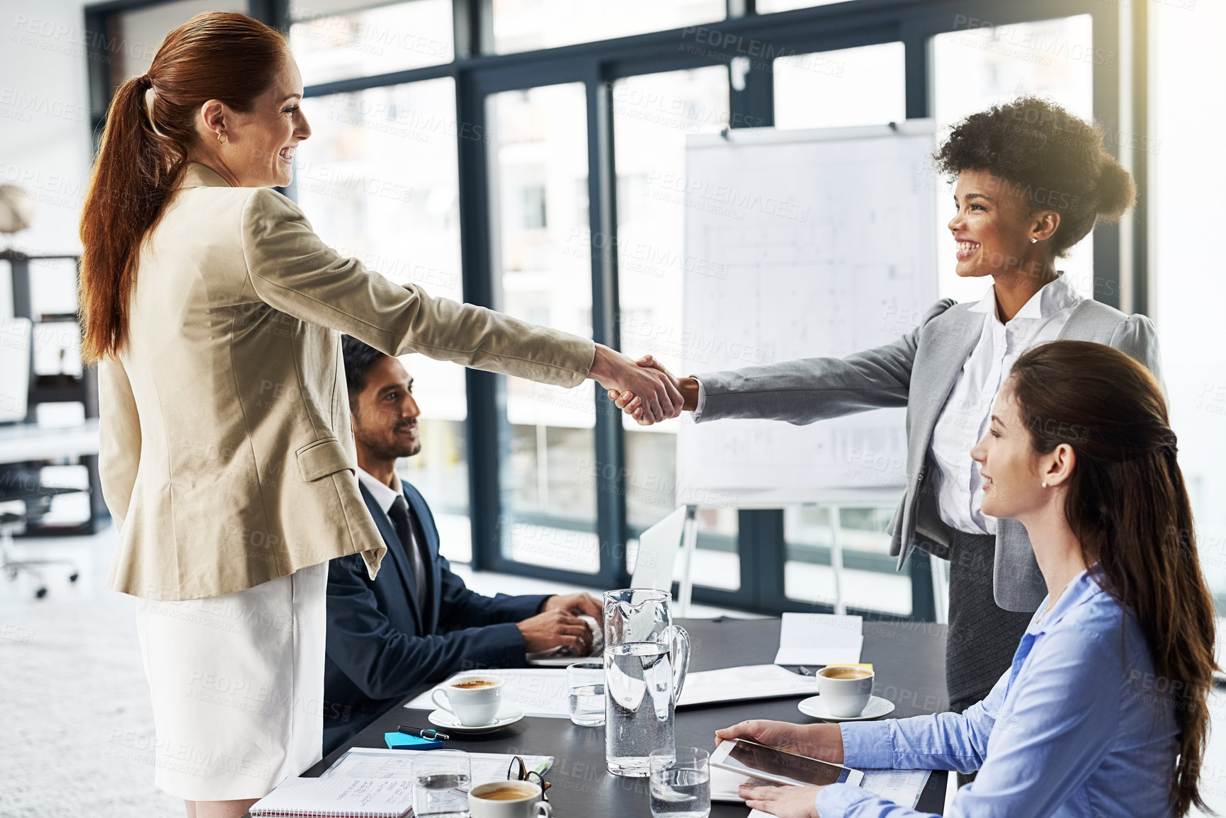 Buy stock photo Business woman, handshake and meeting with partnership for introduction, greeting or agreement at office. Happy group or employees shaking hands for deal, b2b or teamwork in boardroom at workplace