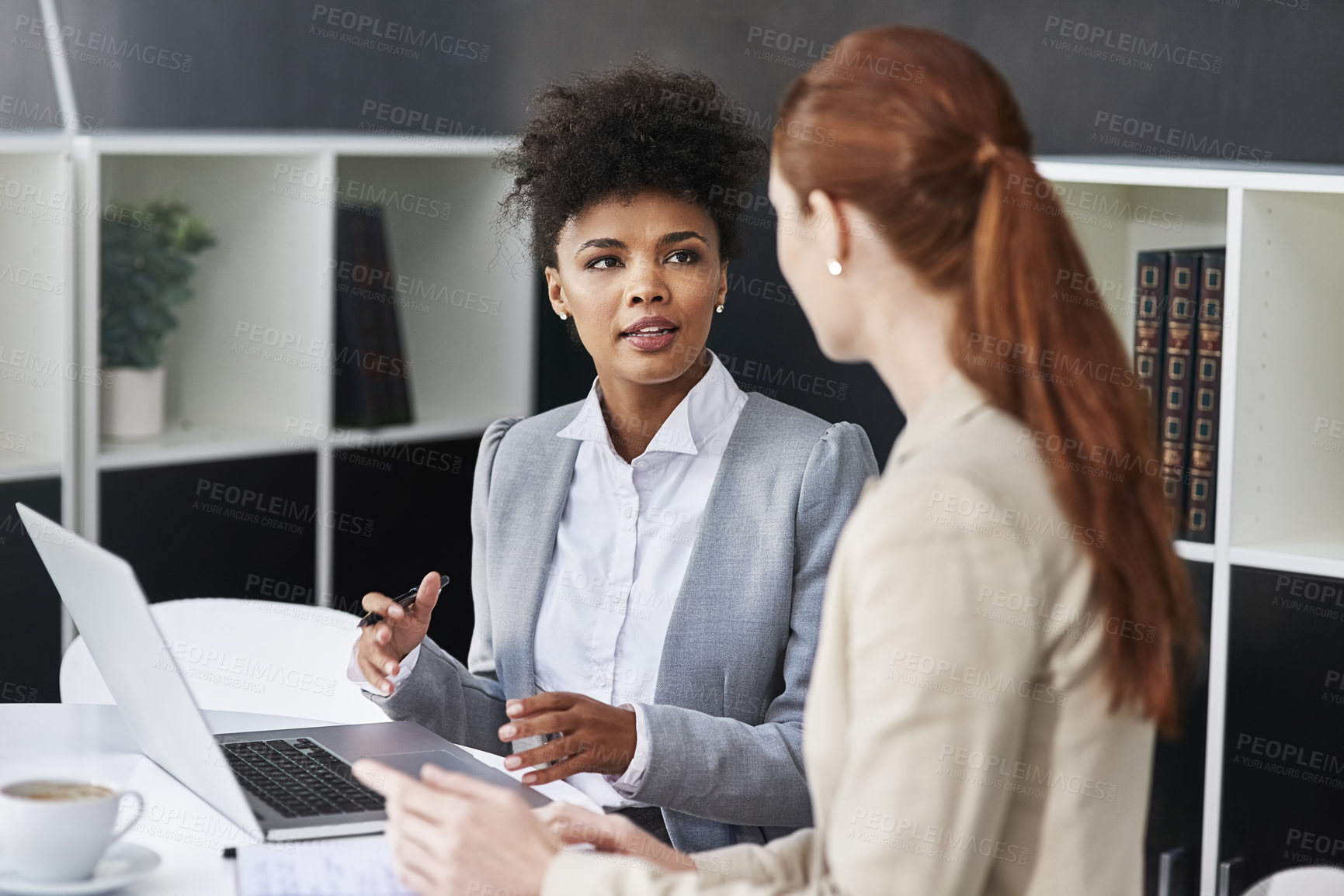 Buy stock photo Talking, meeting or business women with laptop in office for support or speaking of research news. Teamwork, online or financial consultants in conversation, communication or discussion in workplace