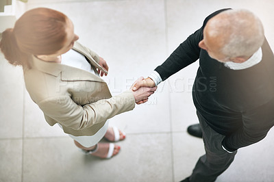 Buy stock photo Business people, handshake and meeting in top view for hiring, recruitment and employee onboarding. Mature manager or employer shaking hands with candidate, job interview, welcome or introduction