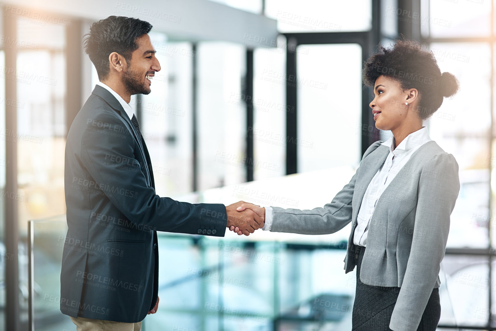 Buy stock photo Shot of two businesspeople shaking hands