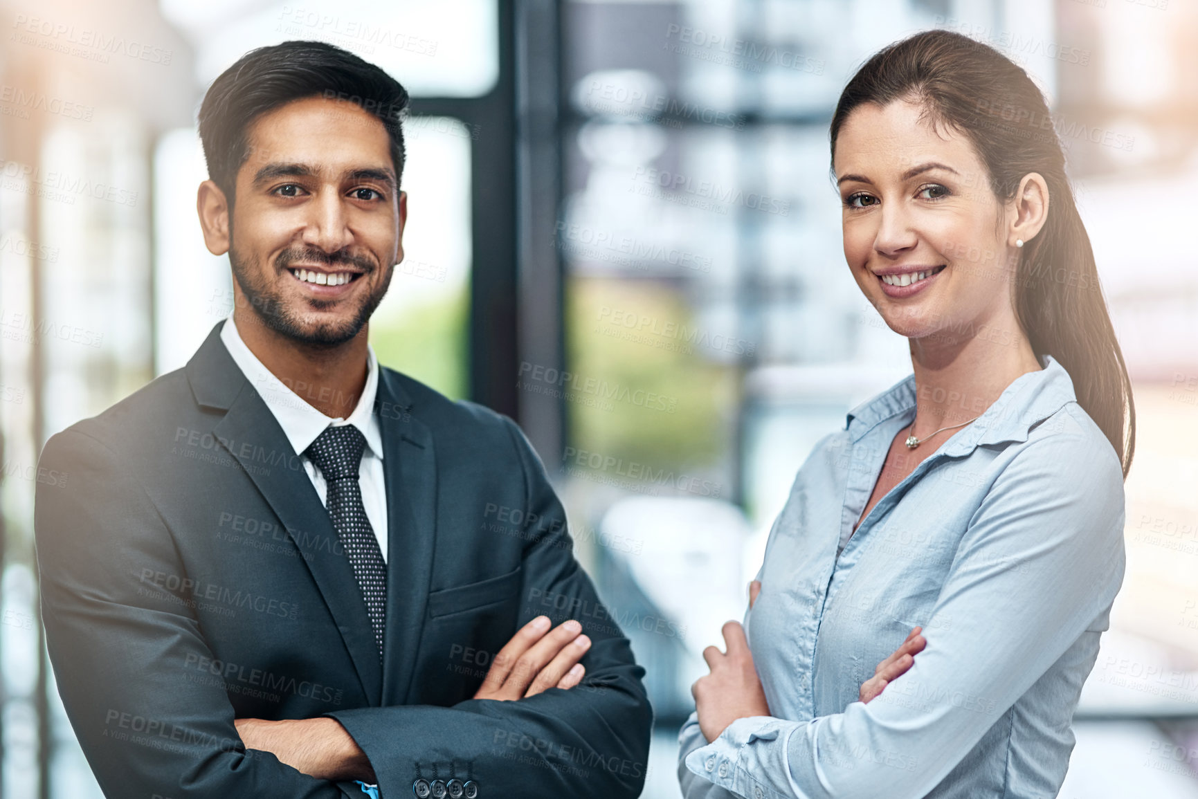 Buy stock photo Shot of two businesspeople standing side by side