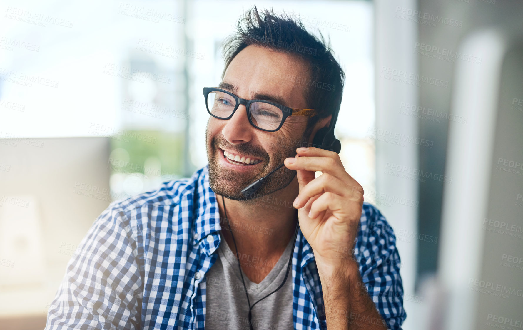 Buy stock photo Happy man, consultant and headphones with glasses at call center for customer service or technical support at office. Young, male person or agent consulting with smile for online advice or assistance