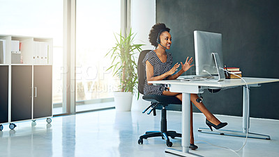 Buy stock photo Shot of a support agent working in a modern office