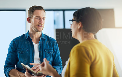 Buy stock photo Cropped shot of colleagues having a discussion in a modern office