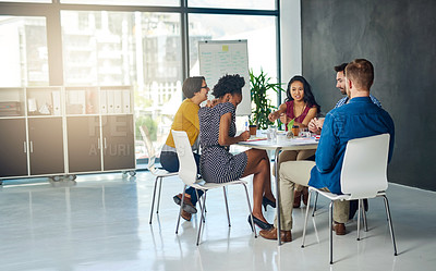Buy stock photo Shot of a group of colleagues having an office meeting together