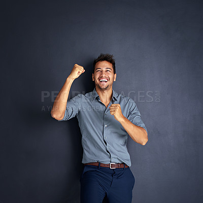 Buy stock photo Portrait, happy man and winning fist in studio for success, victory or small business loan approval. Face, hand and male entrepreneur celebrating good news or career milestone on black background
