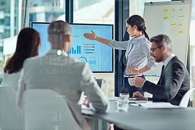 Buy stock photo Cropped shot of a businesswoman delivering a presentation in the boardroom