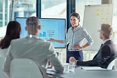 Buy stock photo Cropped shot of a businesswoman delivering a presentation in the boardroom