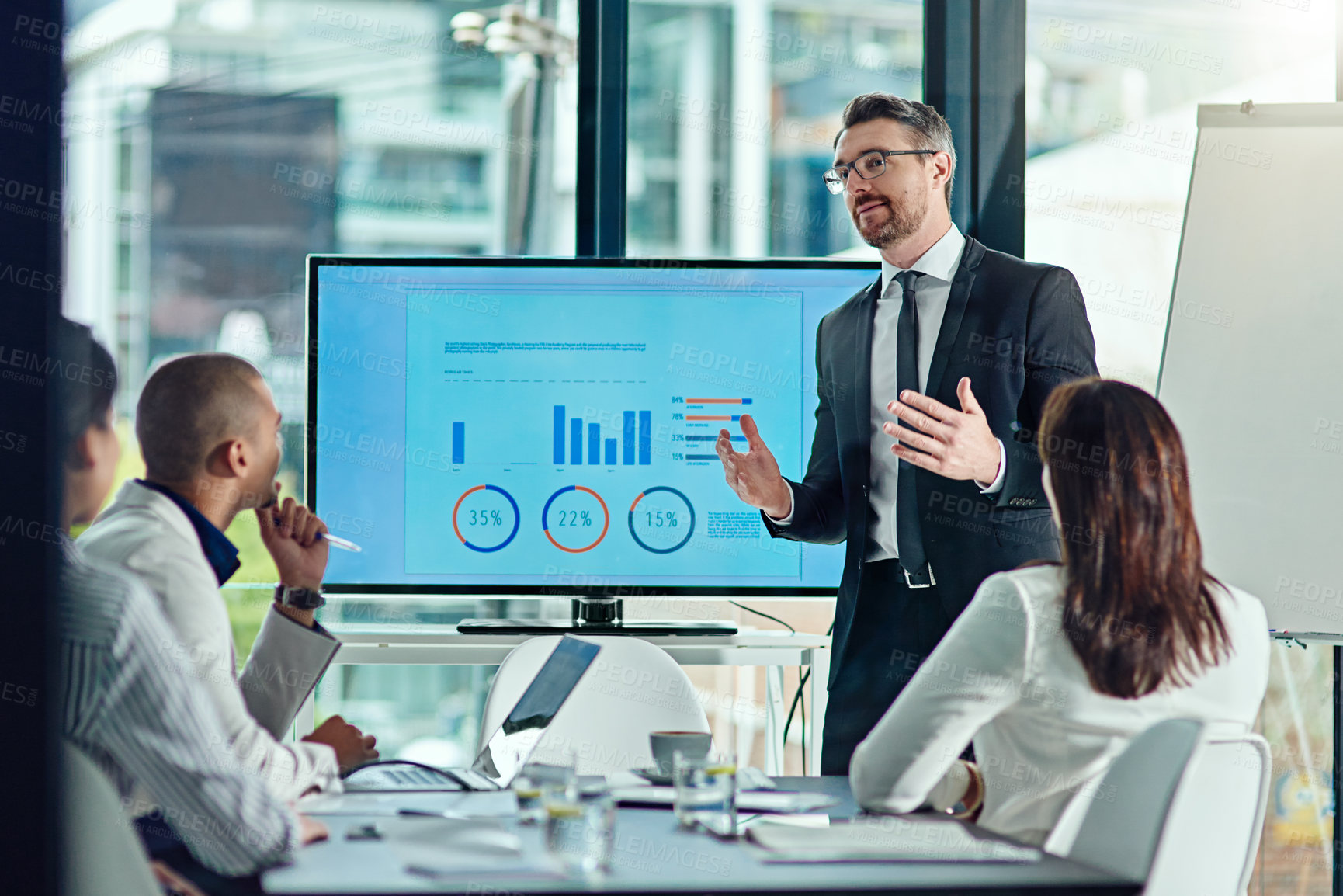 Buy stock photo Cropped shot of a businessman delivering a presentation in the boardroom