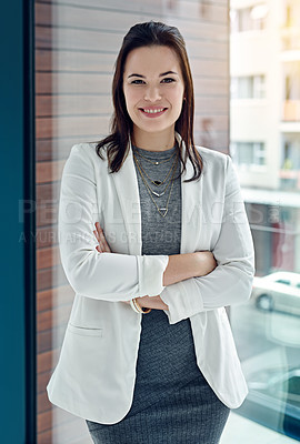 Buy stock photo Portrait of a successful businesswoman standing in their office