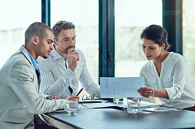 Buy stock photo Shot of colleagues having a meeting in an office