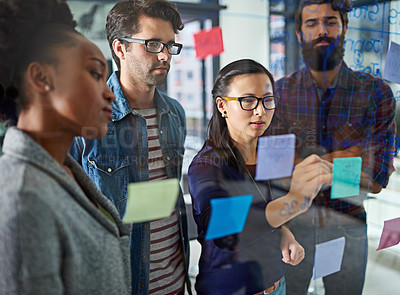 Buy stock photo Team, brainstorming and notes on glass in office for schedule or daily routine for tasks or targets. Employees, window and creative designers looking on calendar for projects, timelines and goals.