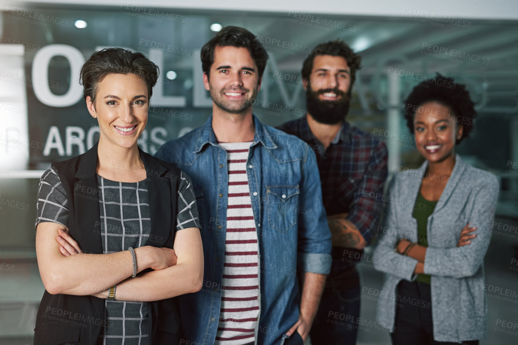 Buy stock photo Cropped portrait of a group of creative businesspeople standing in their office