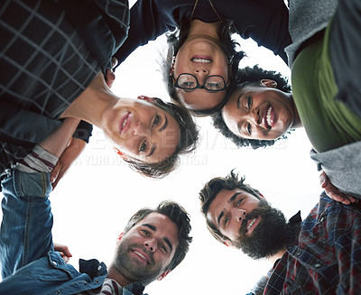 Buy stock photo Cropped shot of a group of creative businesspeople in a huddle