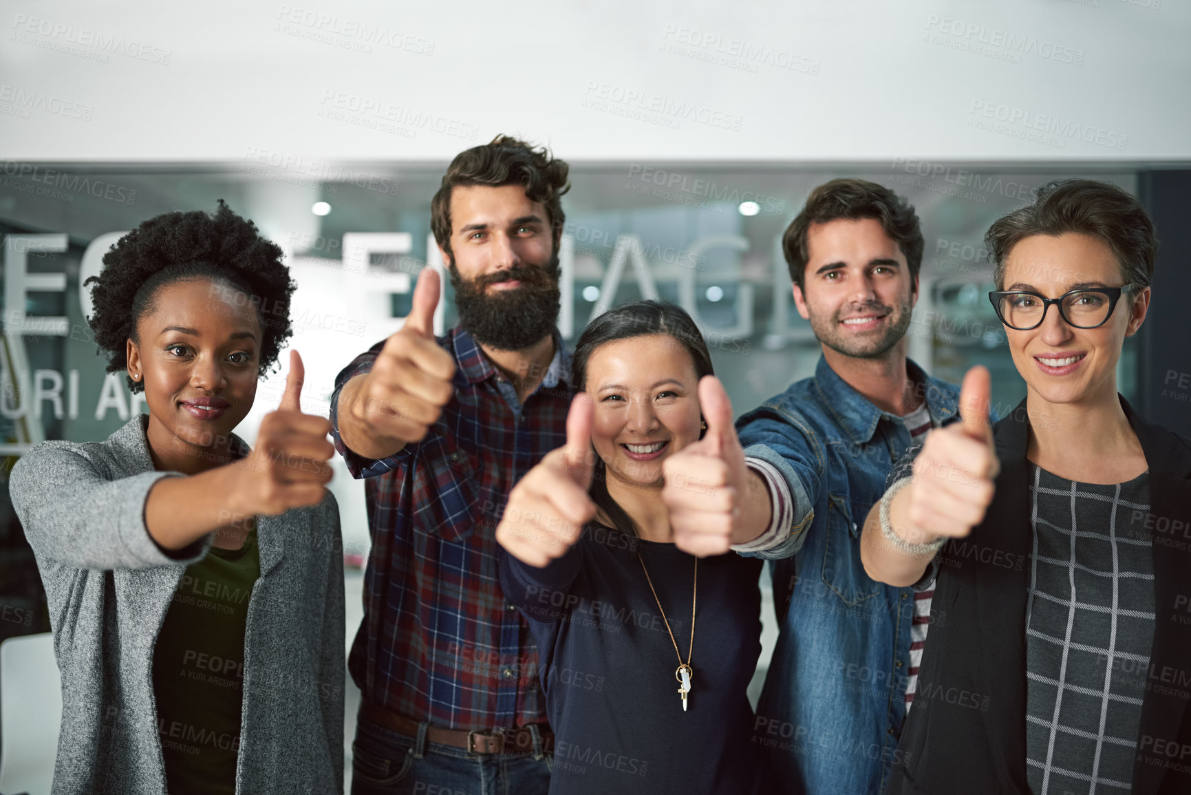 Buy stock photo Portrait, diversity and teamwork with thumbs up for success, startup and design project in creative agency. Collaboration, men and women in office with pride for company development and happiness