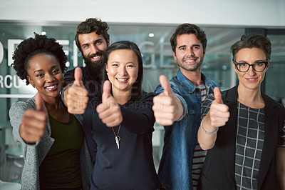Buy stock photo Cropped shot of a group of creative businesspeople showing thumbs up