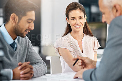 Buy stock photo Cropped portrait of a businesswoman sitting in a meeting with two of her colleagues