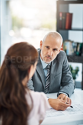 Buy stock photo Cropped shot of two businesspeople meeting in their office