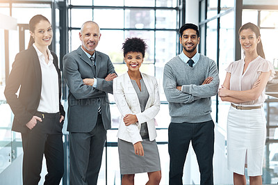 Buy stock photo Portrait of a happy group of colleagues standing together in a modern office