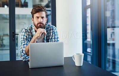 Buy stock photo Portrait of young a designer working on a laptop in a modern office