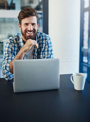 Buy stock photo Portrait of young a designer working on a laptop in a modern office