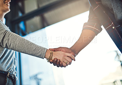 Buy stock photo Closeup shot of businesspeople shaking hands in an office