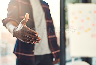 Buy stock photo Closeup shot of a young businessman gesturing for a handshake
