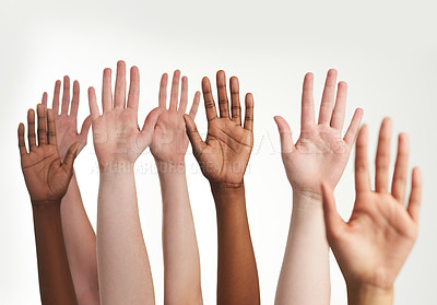 Buy stock photo Cropped shot of a group of hands reaching up together