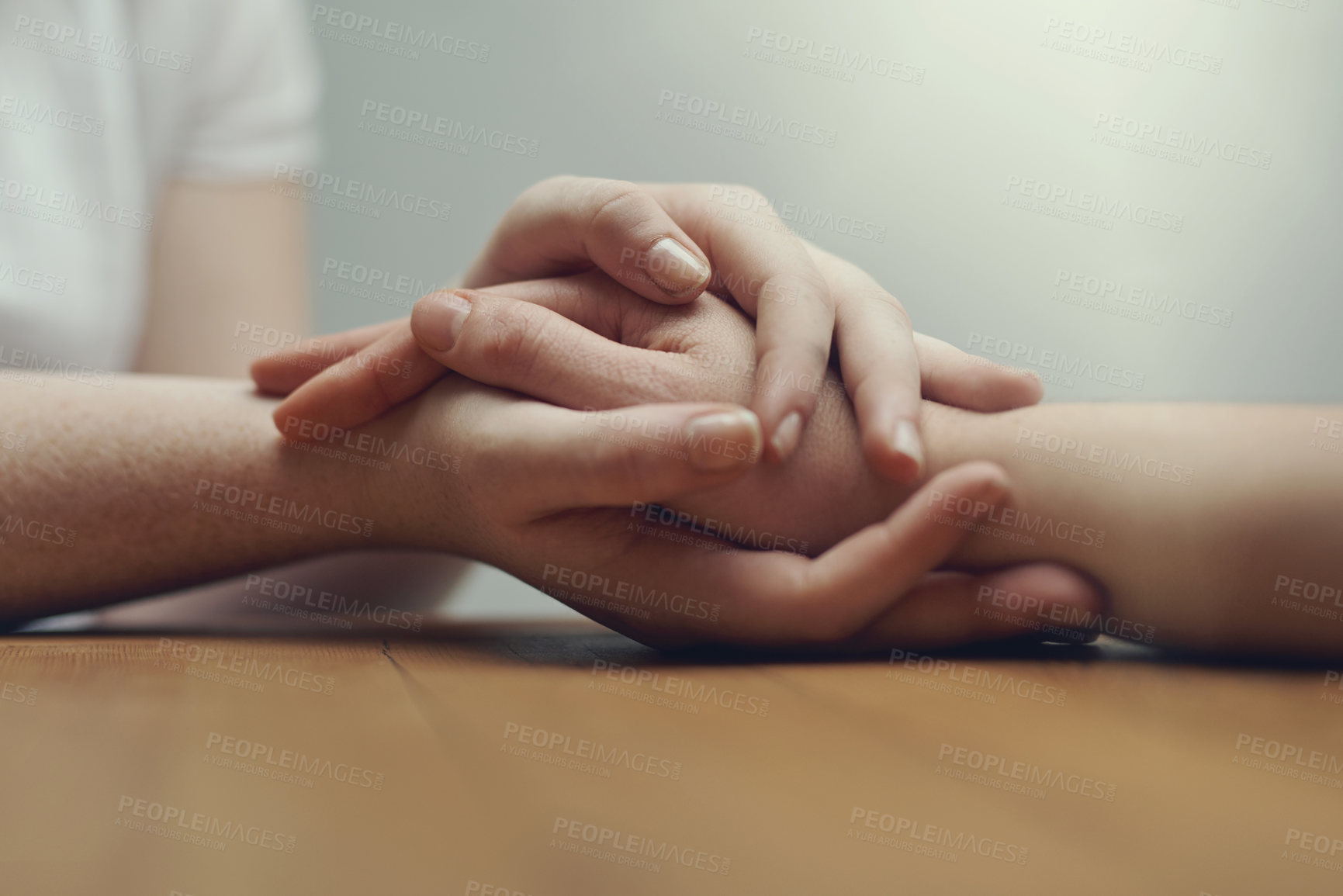 Buy stock photo Cropped shot of two people holding hands in comfort