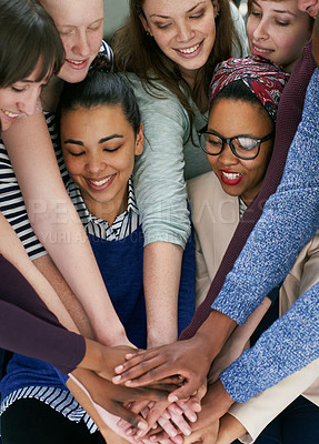 Buy stock photo Cropped shot of a group people  putting their hands together in unity