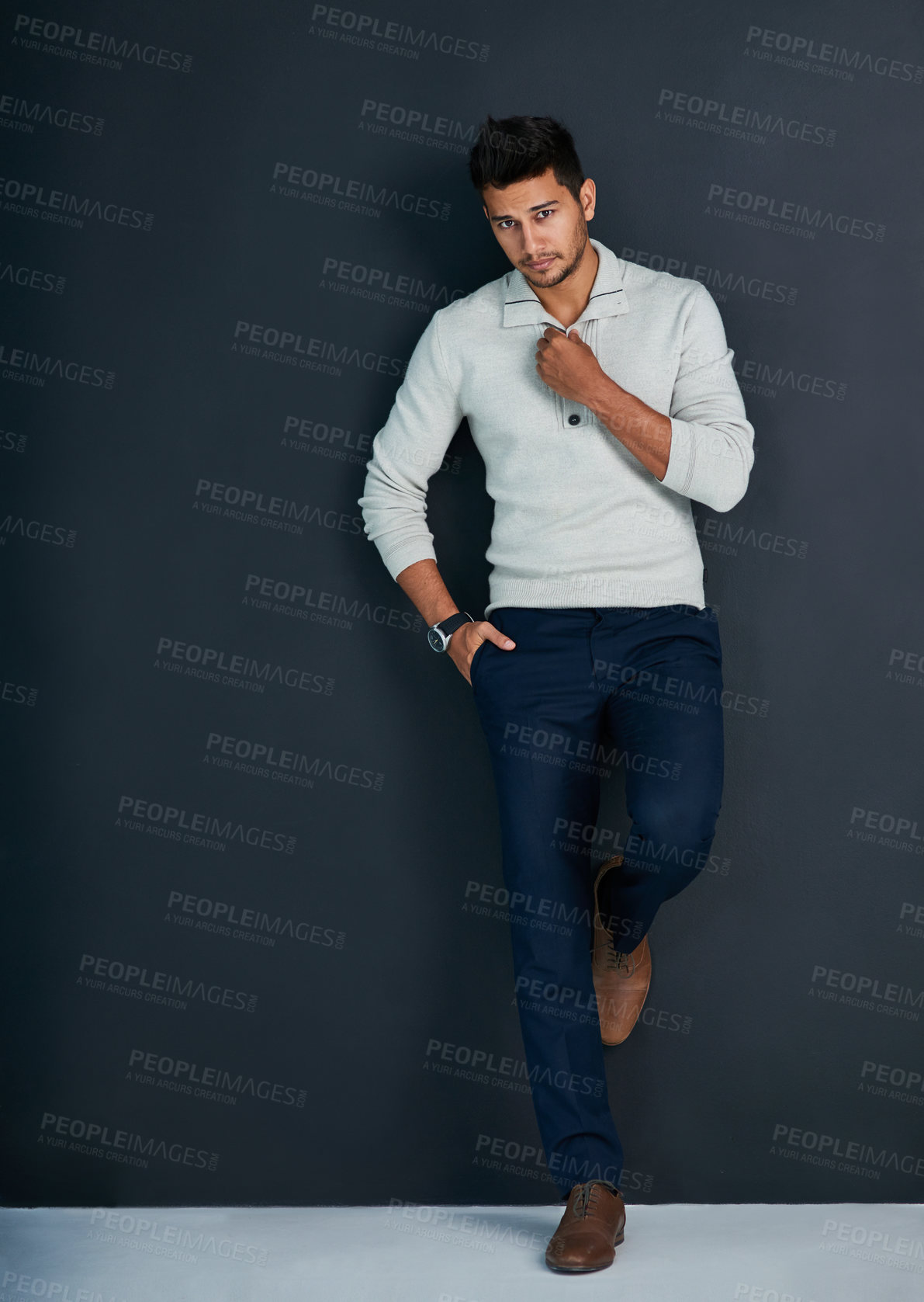 Buy stock photo Portrait, clothes and man in studio, fashion and serious with minimalism, confidence and proud of outfit. Dark background, stylish and person in jeans, denim and professional for business and job