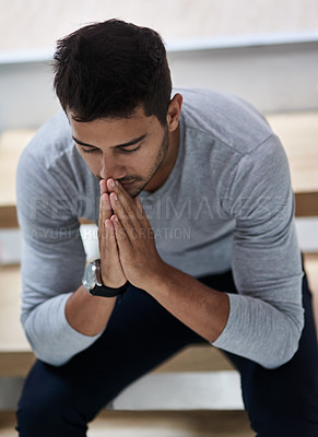 Buy stock photo Shot of a young man praying