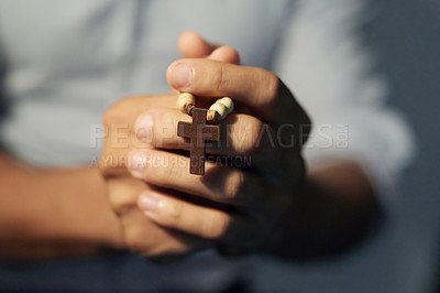 Buy stock photo Cropped shot of a man's hands holding a rosary