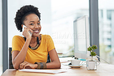 Buy stock photo Cropped portrait of a young designer talking on her cellphone in her office