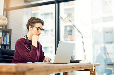 Buy stock photo Office, laptop and woman at creative agency with reading, thinking and online market research at startup. Website, digital professional and businesswoman at computer checking review, email or report.