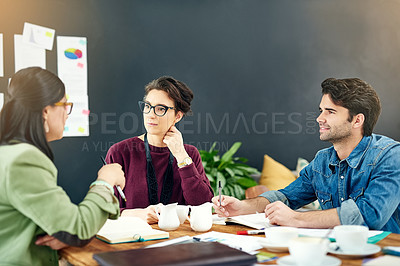 Buy stock photo People, teamwork or journalists talking in meeting for writing solution, conversation or discussion in startup. Notes, report or writers in office for planning, creative ideas and group collaboration