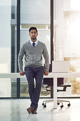 Buy stock photo Portrait, business and man leaning on desk, modern office and lens flare with professional and corporate job. Face, person or employee with confidence or entrepreneur with furniture, startup or pride