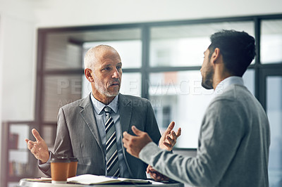 Buy stock photo Senior male, young and man for mentor, paperwork and coffee in office for advice in business. Mature, employee and intern as colleagues in meeting for collaboration, ideas and vision in corporate
