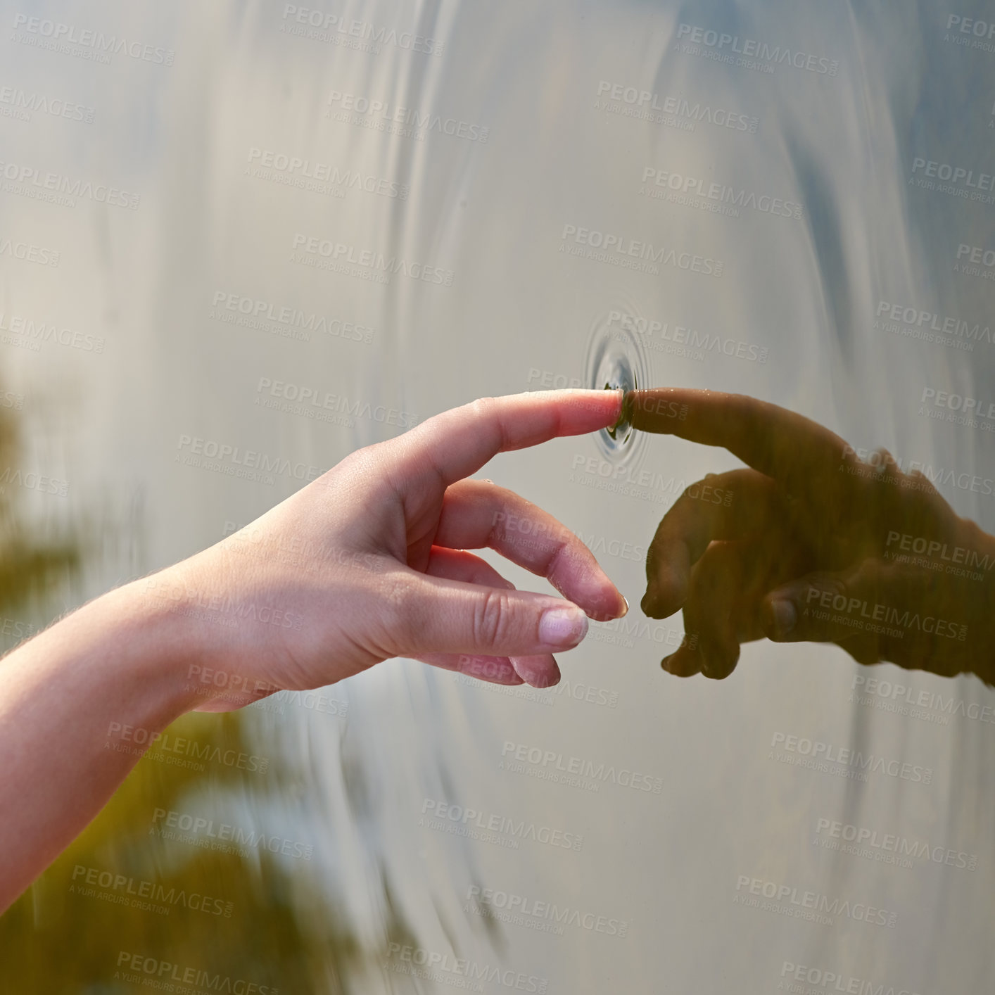 Buy stock photo Cropped shot of a finger touching water to form ripples