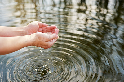 Buy stock photo Hands, cupped and lake with fresh water for drinking or sustainability with calm in outdoors with splash. Wellness, spring and sunshine with health or clean river with respect for nature with person.