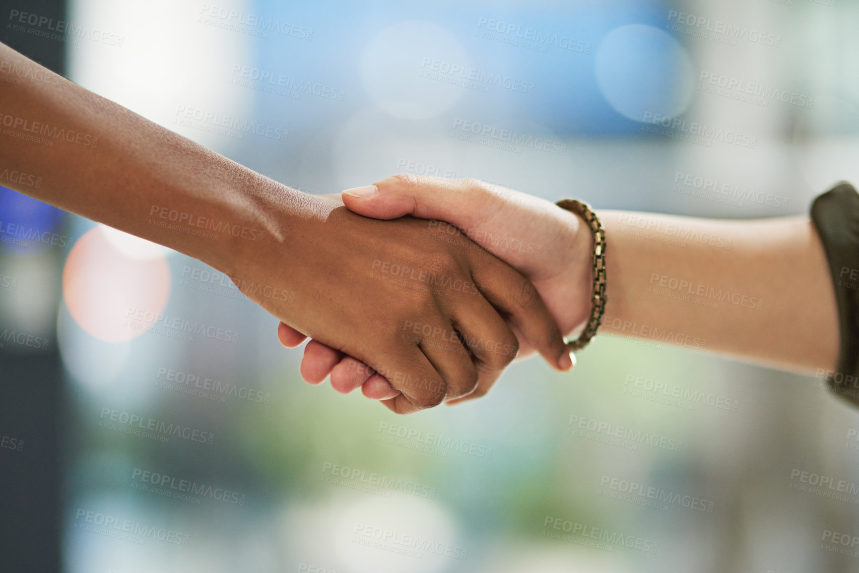 Buy stock photo Cropped shot of two unidentifiable businesspeople shaking hands